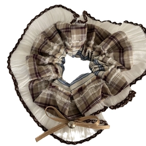 Vintage brown plaid scrunchie with lace trim, satin bow, and small metal bell accent