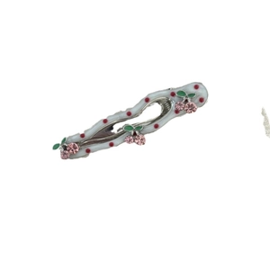 Chic wavy cherry hair clip with white polka dot base and red rhinestone accents