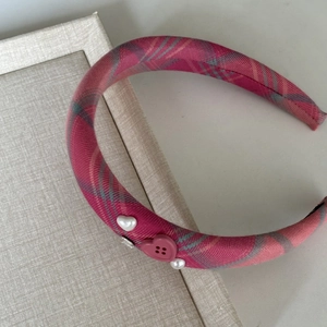 Pink plaid padded headband with heart button and pearl accents for women