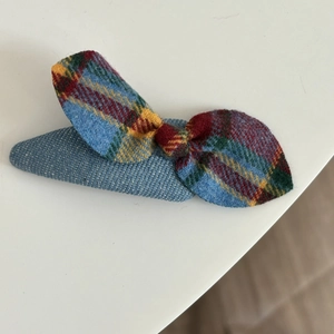Vintage yellow and blue plaid bow hair clip with denim fabric base in a sweet retro style