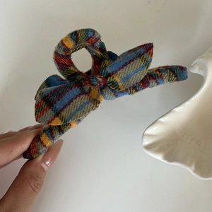 Vintage yellow and blue plaid bow hair claw clip with a classic fabric texture finish