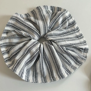 Minimalist black and white striped oversized fabric scrunchie with textured cotton fabric