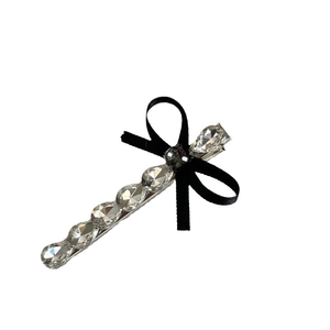 French vintage hair clip with crystal grey diamonds and a black ribbon bow accessory