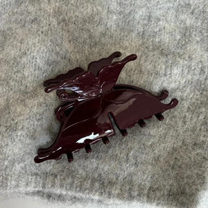 Glossy burgundy butterfly hair claw clip in a minimalist French acetate style for women