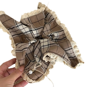Brown plaid oversized hair scrunchie with cream lace trim and pearl bow accent