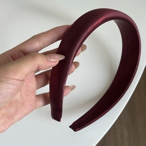 Padded burgundy satin headband with premium silk texture and elegant retro pleated design
