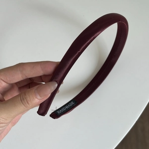 Elegant cherry red satin headband with vintage pleated design for high cranial top look
