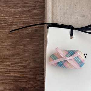 Vintage plaid fabric oval hair clip with pink ribbon bow on a decorative card
