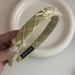 Green and red plaid headband with white bows and pearl detail for women