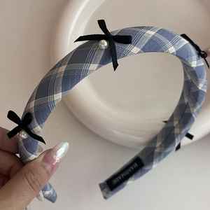 Handmade blue plaid headband with black bows and white pearls for elegant hair styling