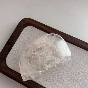 French lace pattern hair claw clip with elegant white floral resin design for women