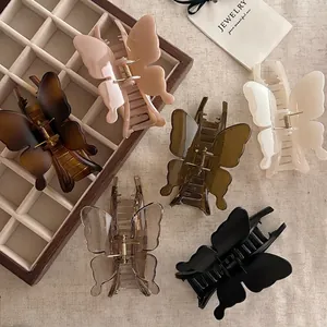 French vintage butterfly hair claw clips set in six colors on a linen background