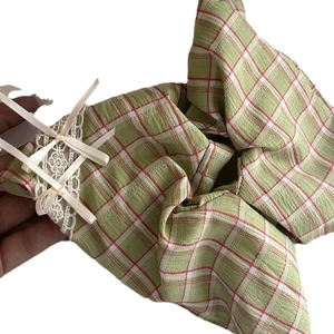 Fresh green plaid fabric hair scrunchie with lace trim and satin bow decoration