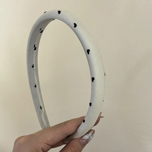 White satin padded headband with black heart polka dots and thick sponge interior
