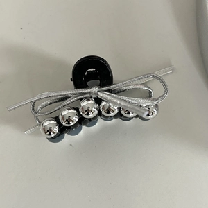 Silver bow hair claw clip with metallic beads on black base for women's half-up hairstyles