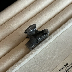 Silver bow hair claw clip with grey marble ink pattern for elegant back head styling