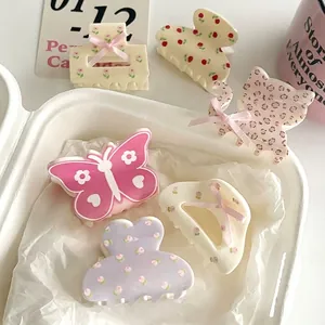 Floral hair claw clip set with pink butterfly and leopard heart patterns for girls