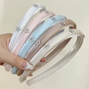 Star-shaped rhinestone satin headbands in pastel colors with non-slip inner grip