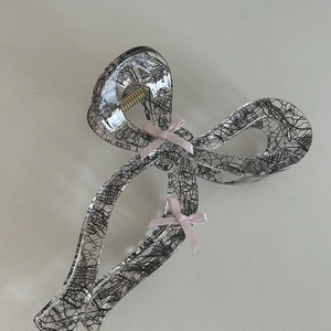 Pink ribbon lace bow hair claw clip made of clear resin for elegant hair styling