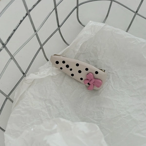 Sweet pink bow hair clip with black polka dots on cream resin base for girls