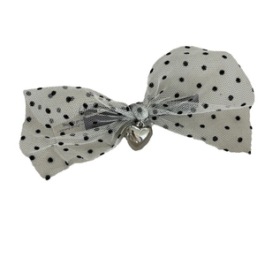 Elegant mesh bow hair clip with black polka dots and a silver heart pendant accessory