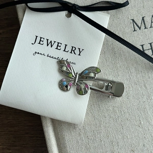 Hollow butterfly hair clip with colorful polka dots on white ribbon gift card