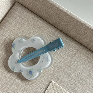 Sweet blue floral hair clip with matte flower design and metal duckbill grip for women