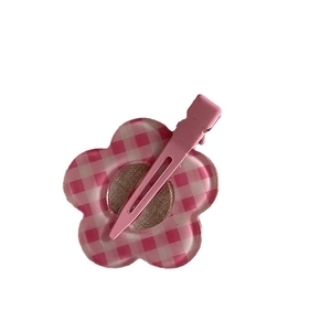 Sweet pink floral hair clip with checkerboard pattern and secure metal duckbill clamp