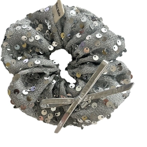 Silver sequin hair scrunchie with bow knot and handmade tag for elegant hair styling