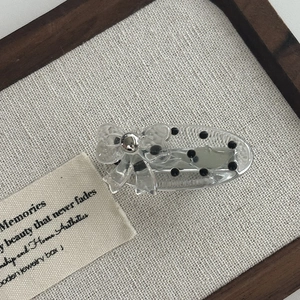 Polka dot lace bow acrylic hair clip for women with minimalist duckbill clip design