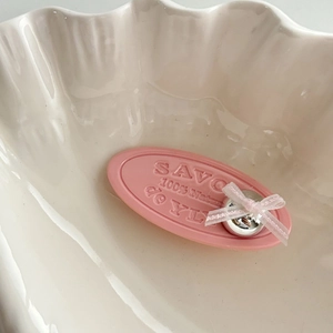 Pink soap-shaped bow hair clip with silver heart and embossed 100% nature text