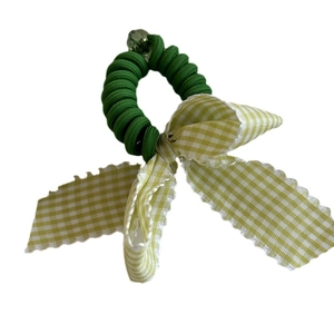 Pastel blue spiral telephone wire hair tie with a checkered bow and pearl bead accent