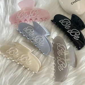 Elegant ballet style acetate hair claws with Bebe pearl letters in five soft pastel colors