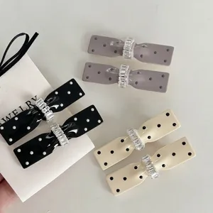 Set of 6 polka dot bow hair clips with rhinestones in black, purple and beige
