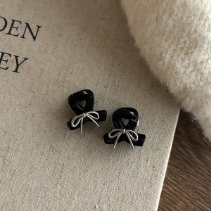 Mini black bow hair claw clips with silver metal knot detail for stylish women