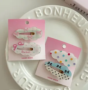 Détails de pinces à cheveux nuages à pois avec décorations de nœuds mignons