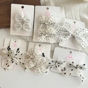 Polka dot chiffon bow hair clips and elastic ties set for children on display card