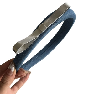 Denim blue headband with metallic silver bow detail for high cranial top hairstyle