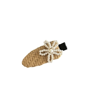 Handcrafted woven rattan hair clip with white pearl flower design and duckbill clip
