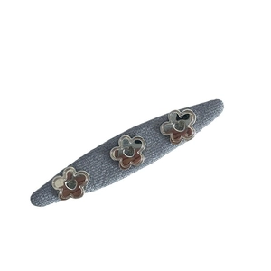 Denim blue floral hair clip with three silver metal flowers for an elegant side fringe look