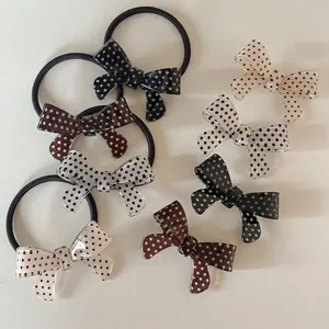 Elegant polka dot bow hair clips and elastic hair ties set in vintage neutral colors