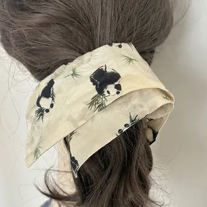 Elegant silk hair scarf with Chinese style panda and bamboo patterns on beige fabric