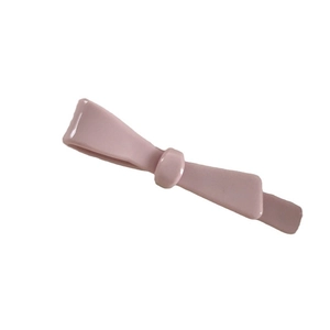Elegant pale pink acetate bow hair clip with a glossy finish for a minimalist sweet style