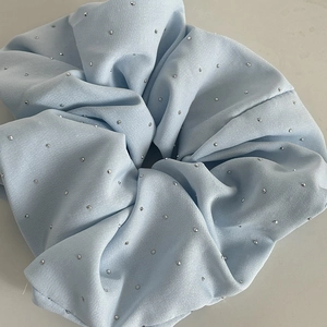 Detailed view of large light blue scrunchie with sparkling silver rhinestones