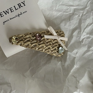 Straw woven ballet style hair clip with colorful K9 crystal hearts and a beige ribbon bow
