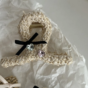 Ballet-style woven hair claw clip with black ribbon bow and heart crystal accents