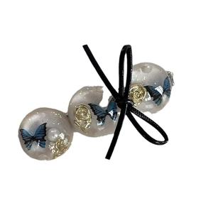 Elegant hair clip featuring blue embossed butterflies and resin beads with a black bow