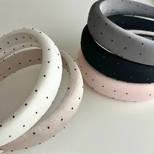Polka dot sponge padded headbands in assorted colors with delicate bead embellishments