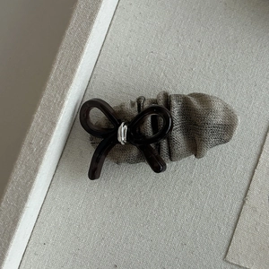 Elegant beige bow hair clip with pleated fabric and resin finish for women