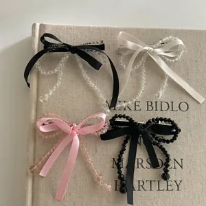 Barrettes à cheveux élégantes avec nœuds en ruban et perles en noir blanc et rose